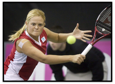 Aleksandra Wozniak  delivers a backhand shot