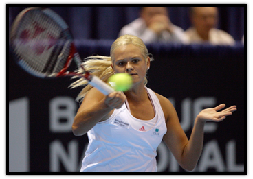 Aleksandra Wozniak  delivers a forehand shot