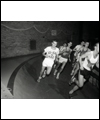 Bruce Kidd running on an indoor track