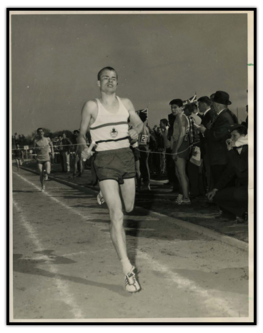 Bruce Kidd at the end of a race