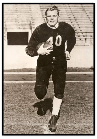 Fritz Hanson with a football under his arm