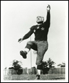 Hugh Stirling kicking a football