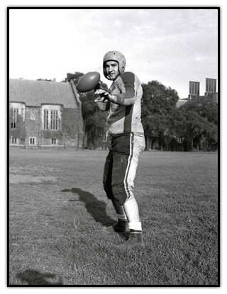 Joe Krol holding a football.