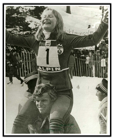 Kathy Kreiner celebrating on Jim Hunter’s shoulders