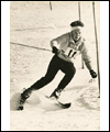 Lucile Wheeler skiing around a pole