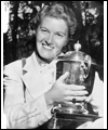 Marlene Streit posing with a trophy