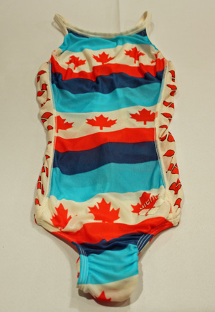 Pattern of red Canadian maple leafs on Nancy Garapick’s swimsuit.