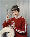 Nancy Greene holding a trophy