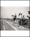 Rich Ferguson running on the outside lane of a track