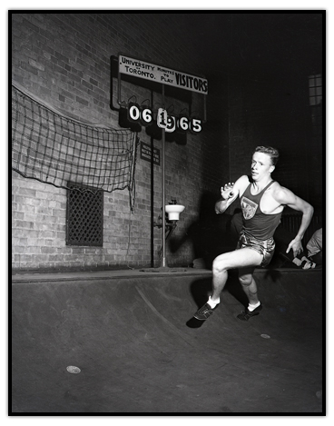 Rich Ferguson running on an indoor track