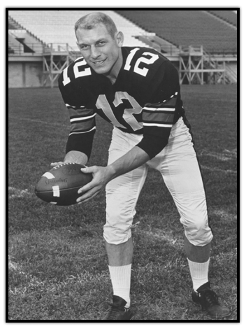 Russ Jackson holding a football with both hands