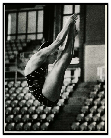 Sylvie Bernier touching her toes while diving